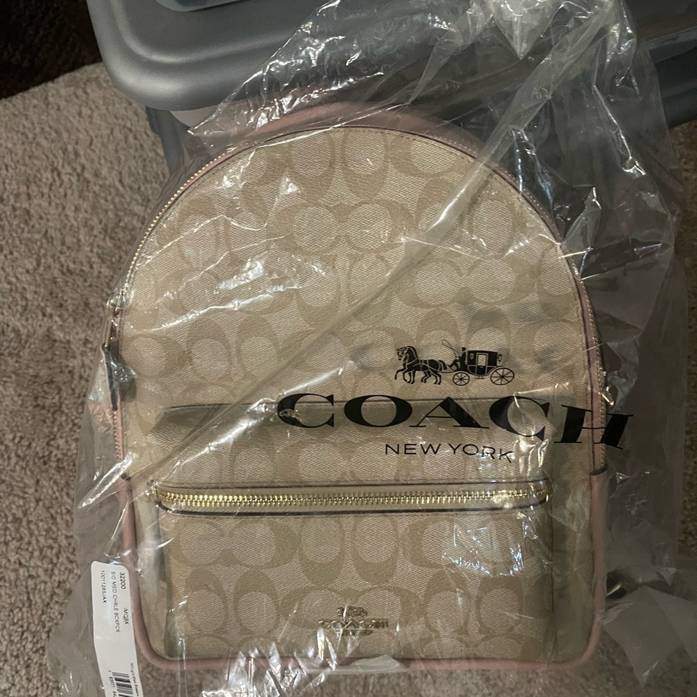 *Brand New* Crème and pink Coach backpack never worn.